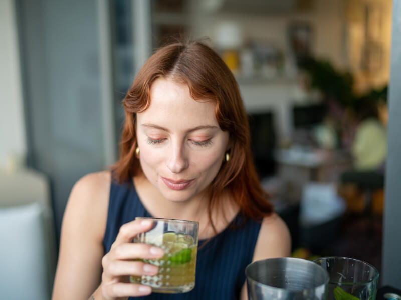 woman making cocktails at home